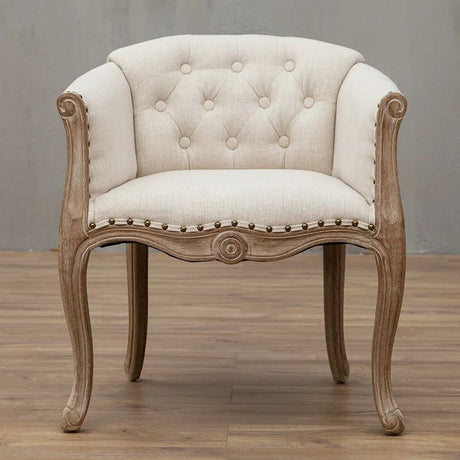 Willem Accent Chair in white linen with tufted back, nailhead trim, and carved natural wood frame.