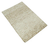 Beige and Ivory Modern Solid Hand Woven Wool Rug
