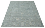 Distressed finished 8x10 Gray and Silver Low Pile wool Rug
