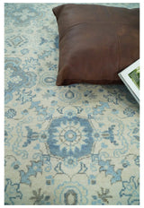 Hand Knotted Traditional Ivory and Blue Oxidized Textured Low Pile Wool Rug