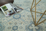 Hand Knotted Traditional Ivory and Blue Oxidized Textured Low Pile Wool Rug