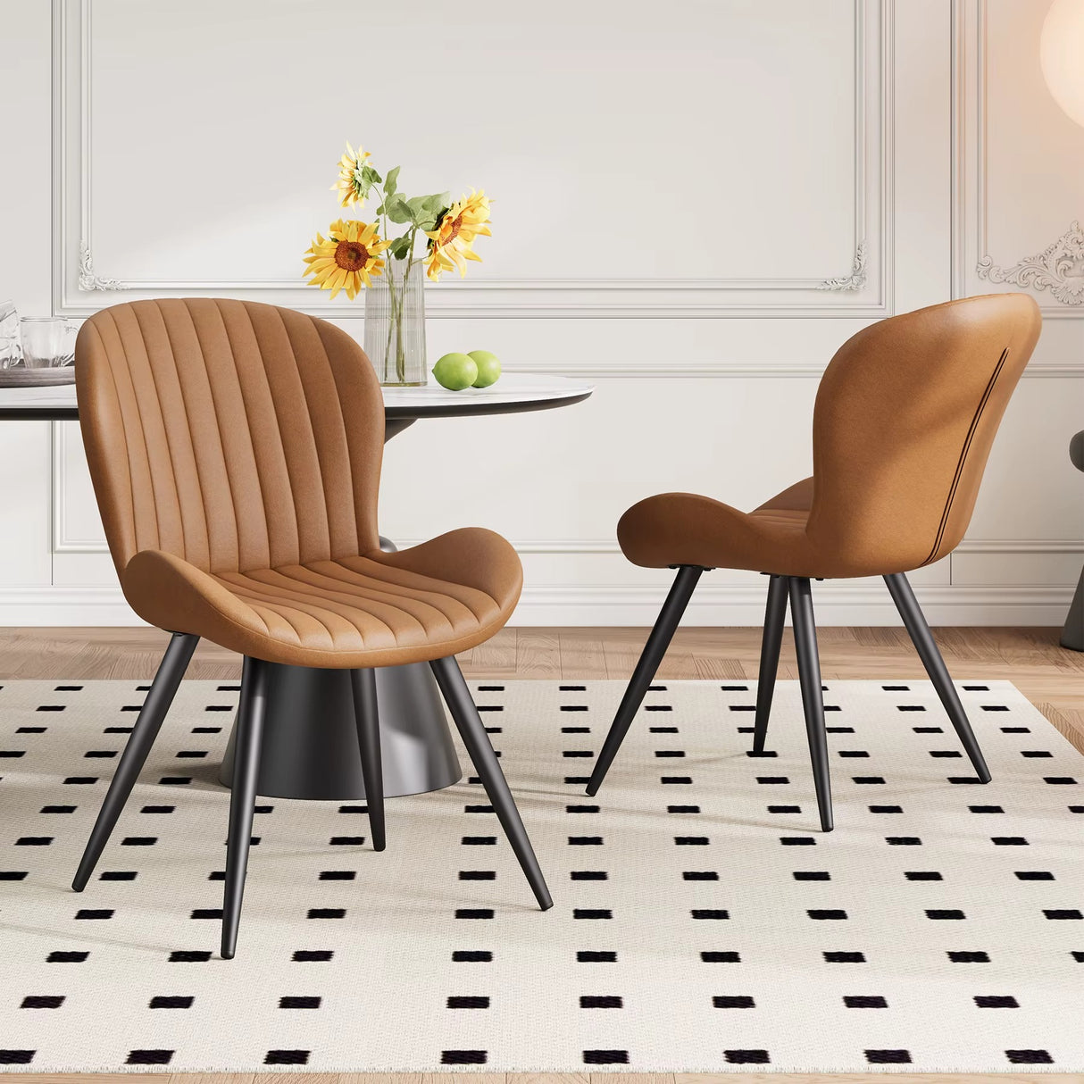 Lorca dining chair in brown faux leather with vertical channel tufting and black tapered legs.
