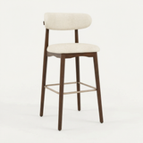 Norden Bar Stool in Ivory with dark wood frame and upholstered seat and back.