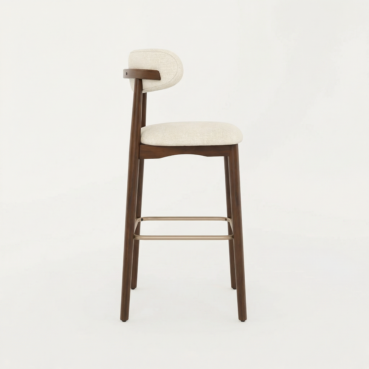Norden Bar Stool with dark wood frame, light fabric upholstered seat and back, and brass footrest.