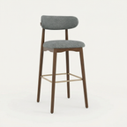 Norden Bar Stool, Slate Counter Stool with gray upholstered seat and back, dark wood frame, and brass footrest.