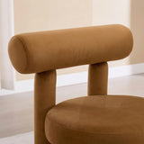 Rogolo Dining Chair with a round, camel-colored velvet seat and cylindrical backrest.